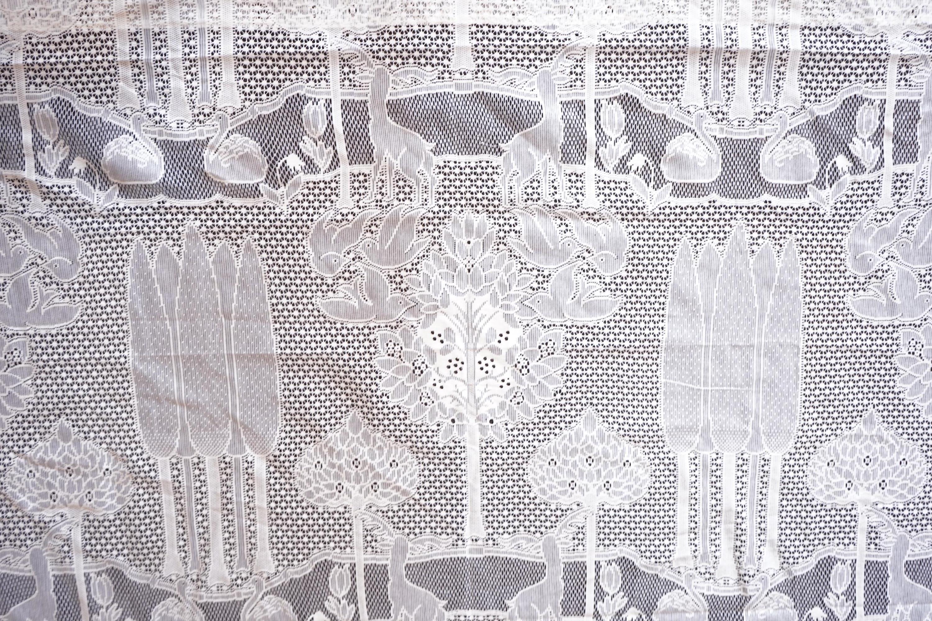 A single C.F.A. Voysey machine lace curtain ‘The Stag’ design, manufactured by Rose’s Mill Ltd, Ayrshire, Scotland. 180cm wide x 240cm long. Condition - unused.